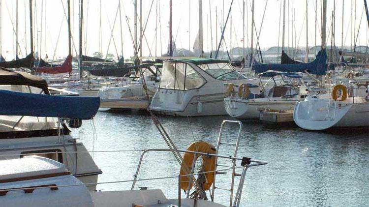 Boats on water in a marina.