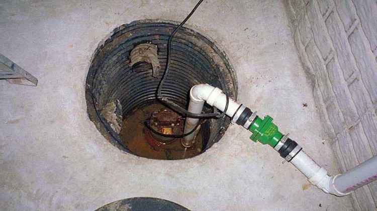 A sump pump in a basement.